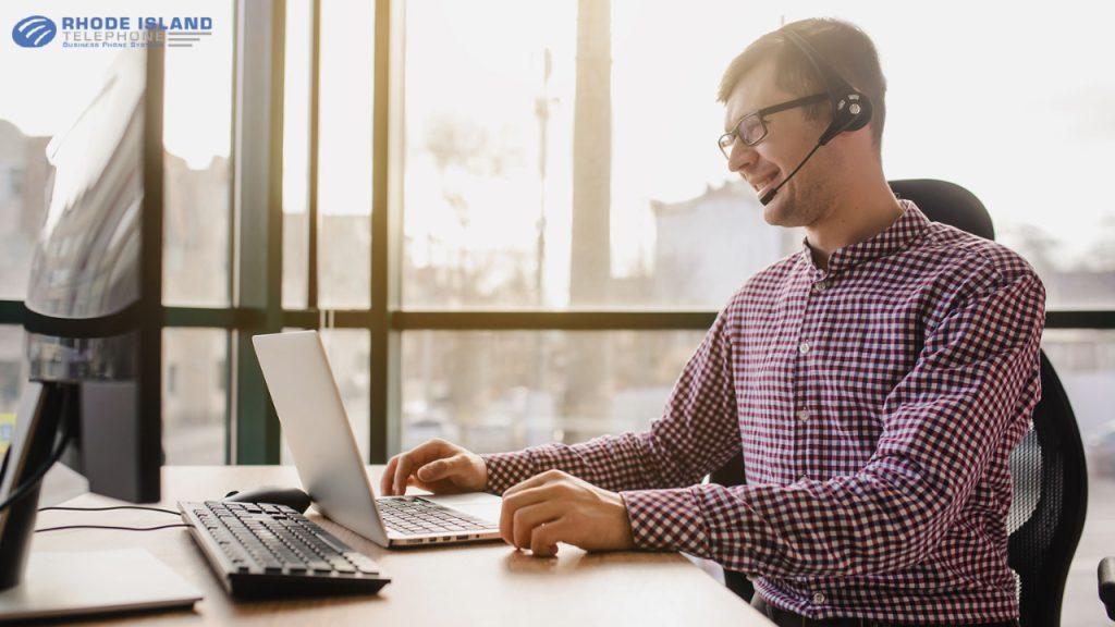 Man using an nec phone headset setup for his business