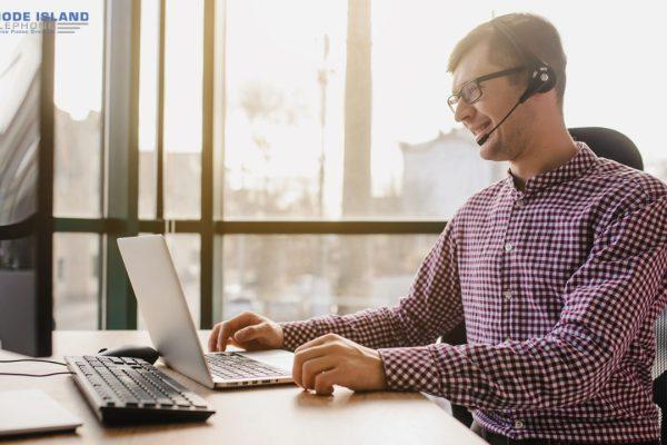 man using nec phone headset setup for his business