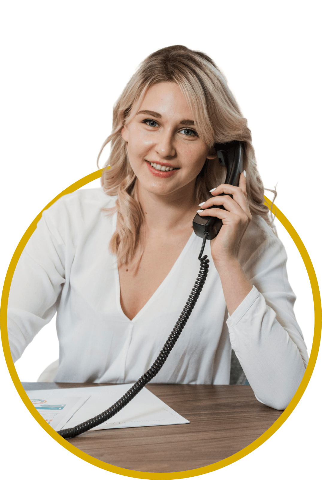 Guide to Switching to a Cloud-Based Phone System - Hero - Rhode Island Telephone - Young woman smiling while using a desk phone