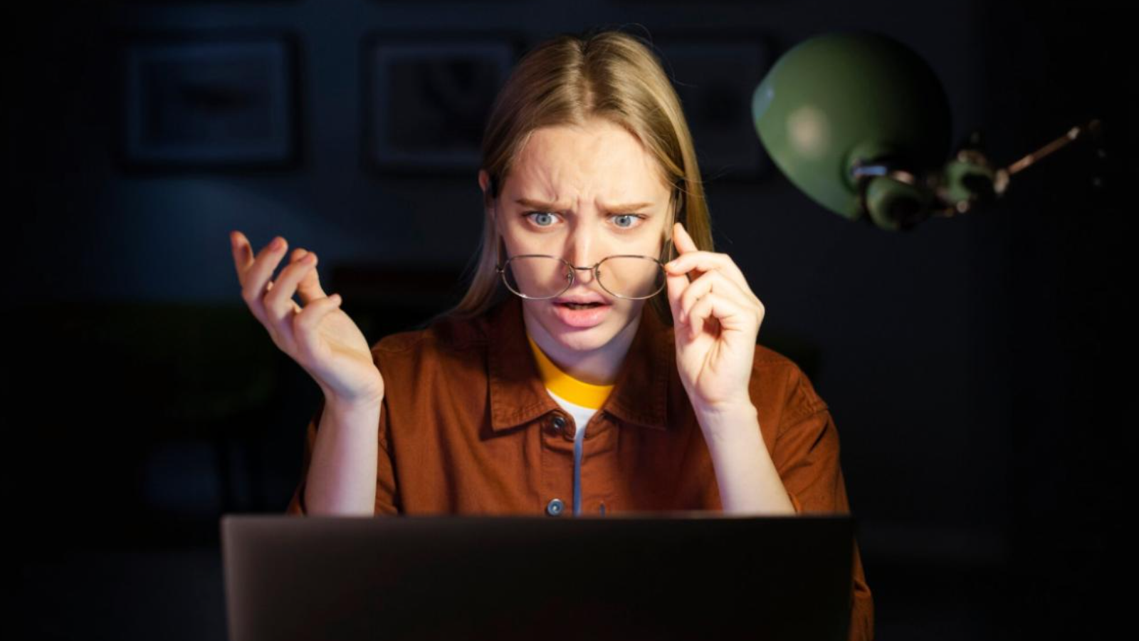 Small Business, Big Demands: The Case for Upgrading to Business Internet Now 2 Woman reacting in frustration at a laptop, highlighting the need for reliable business internet over inadequate home setups.