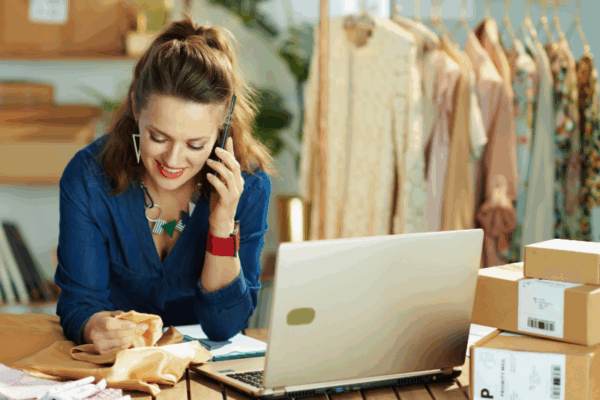 AI in Business Phone Systems AI in business phone systems; woman using cell phone to conduct business