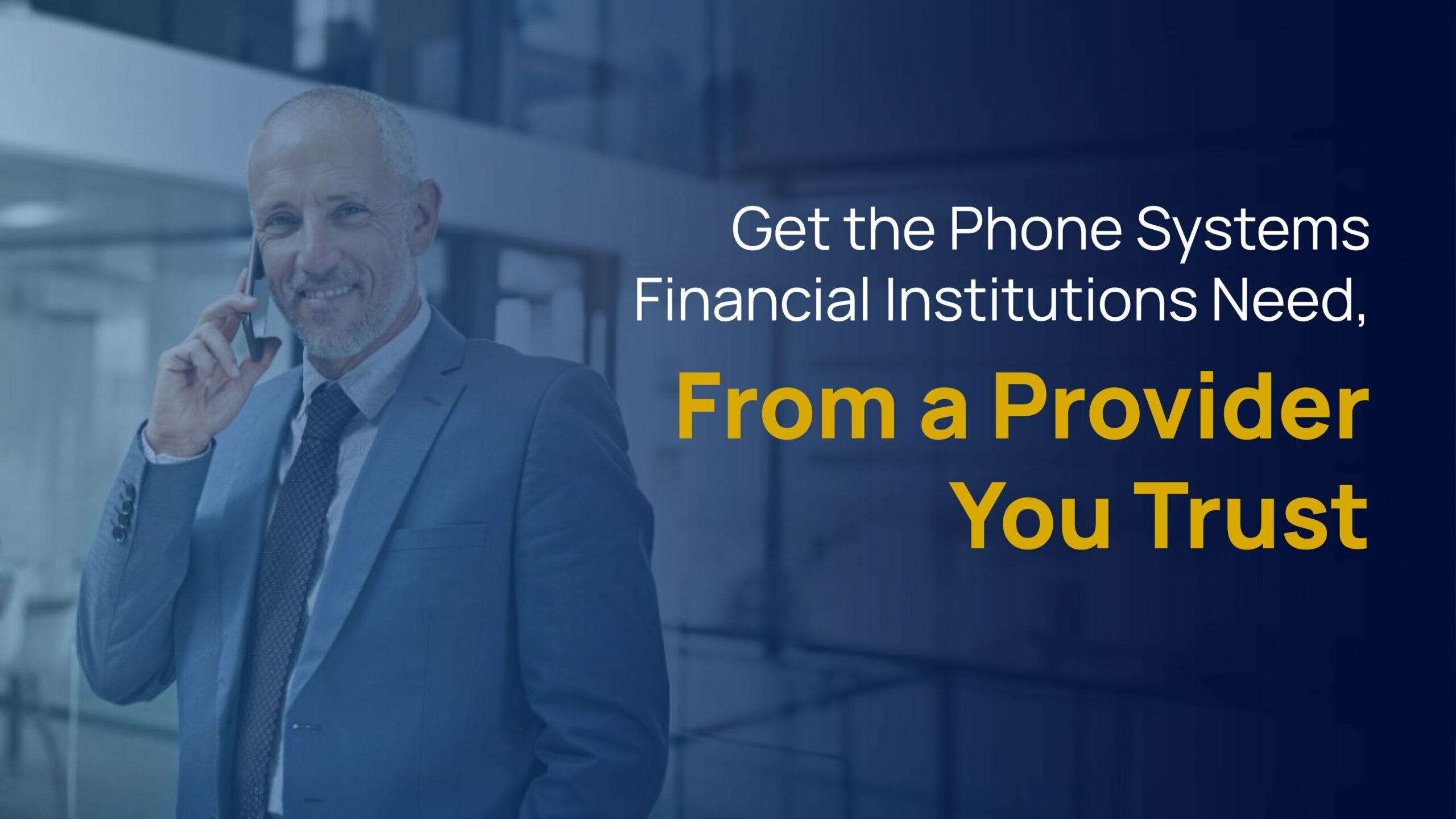 Smiling businessman on a phone call inside a modern office, promoting trusted phone services for banks and financial institutions.