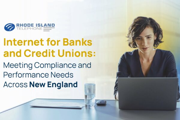 A woman sits at a laptop with a slightly blue and slightly yellow-hued transparent background. On the left of the image we see the Rhode Island Telephone logo along with the title of the blog: 'Internet for Banks and Credit Unions: Meeting Compliance and Performance Needs Across New England'