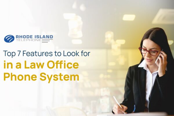 A lawyer sitting at her desk reviewing the list of features the "law practice" need in a "law office phone system."