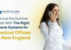A smiling female doctor in a white coat stands near a window, holding a smartphone to her ear. She appears engaged in a call, symbolizing efficient communication in healthcare. Beside her is a promotional graphic for Rhode Island Telephone, with the message: “Survive the Summer Rush With The Right Phone Systems for Medical Offices in New England.” The image promotes modern phone systems for medical offices, emphasizing reliability and preparedness for increased seasonal demand.