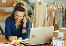 AI in business phone systems; woman using cell phone to conduct business