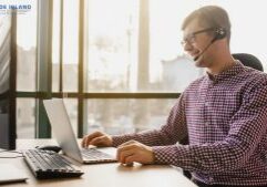 man using nec phone headset setup for his business